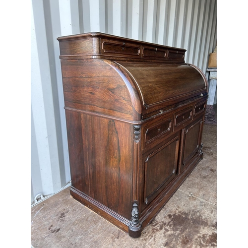 353 - A continental rosewood cylinder top bureau desk 130x60x90