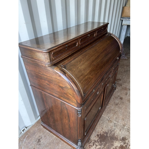 353 - A continental rosewood cylinder top bureau desk 130x60x90