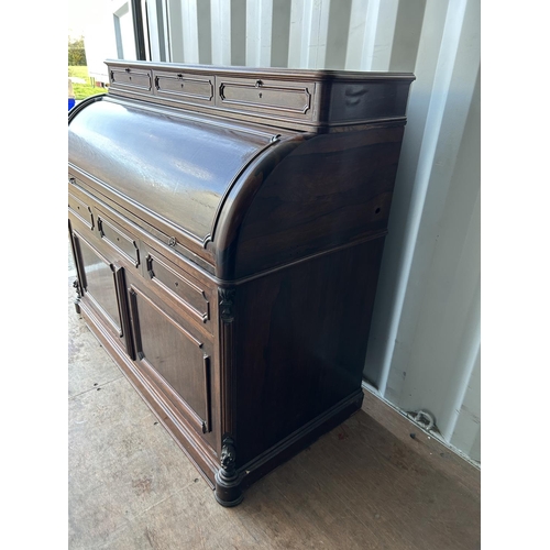 353 - A continental rosewood cylinder top bureau desk 130x60x90