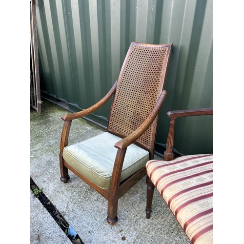 358 - An oak framed begere bedroom chair together with a pair of mahogany carver chairs