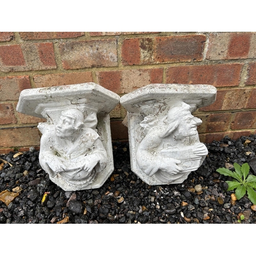 36 - A pair of painted concrete wall mounts