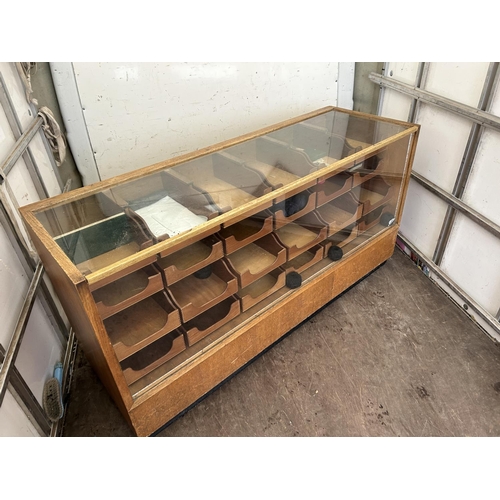 40 - A vintage haberdashery shop serving counter glazed to the top and front with 24 drawers 183x61x92