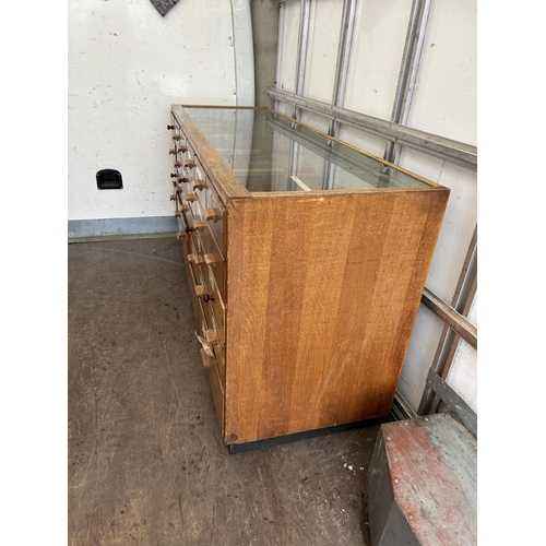 40 - A vintage haberdashery shop serving counter glazed to the top and front with 24 drawers 183x61x92