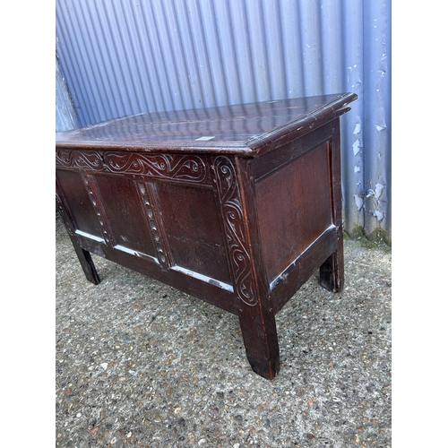 57 - An antique carved  oak three panel blanket box chest  110x50x64