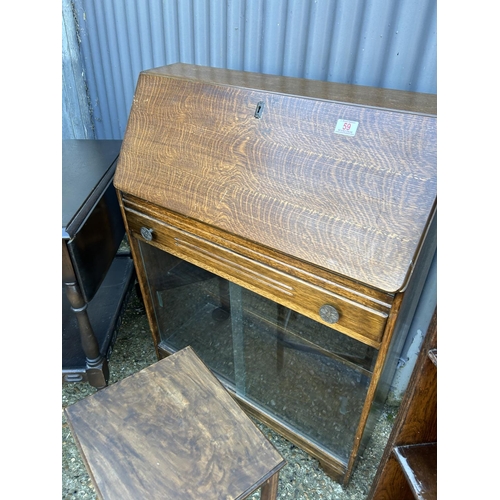 59 - A slim oak bureau, small oak bookcase, tea trolley and a small side tabe