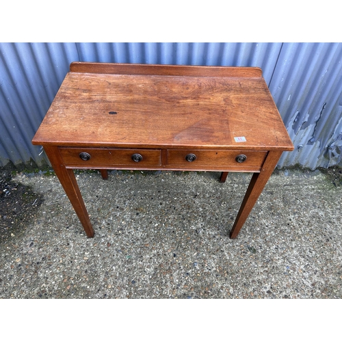 60 - A mahogany two drawer writing tabke 92x50x77