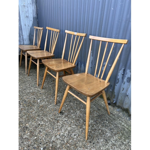 64 - A set of four ercol light elm kitchen chairs