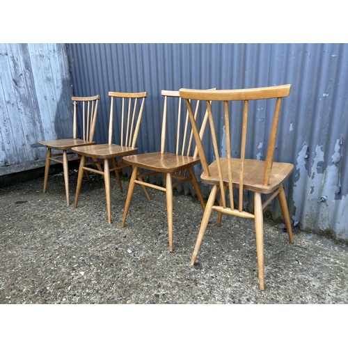 64 - A set of four ercol light elm kitchen chairs