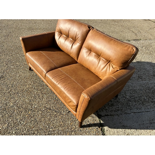 68 - A modern  good quality brown leather two seater sofa