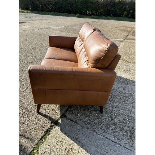 68 - A modern  good quality brown leather two seater sofa