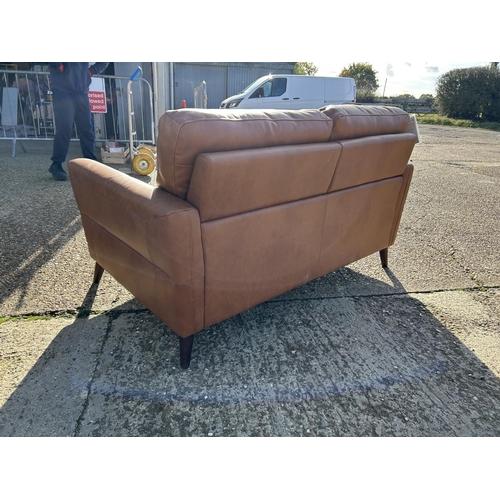 68 - A modern  good quality brown leather two seater sofa