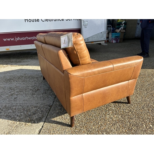 68 - A modern  good quality brown leather two seater sofa