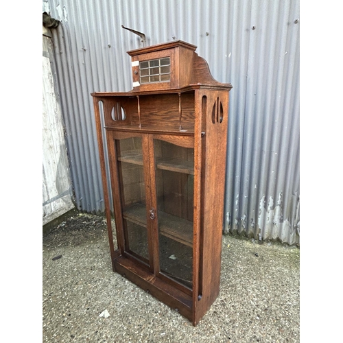 7 - An arts and crafts movement glazed bookcase