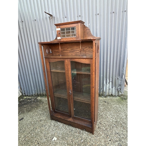 7 - An arts and crafts movement glazed bookcase