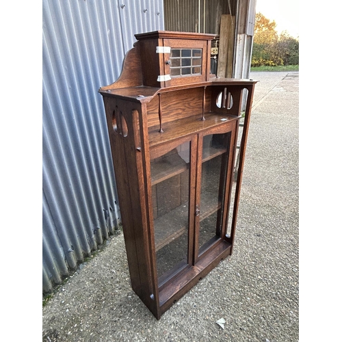 7 - An arts and crafts movement glazed bookcase