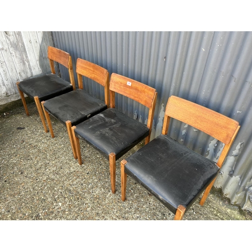 84 - Set of four Danish style dining chairs with black vinyl seats