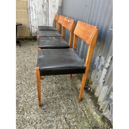 84 - Set of four Danish style dining chairs with black vinyl seats