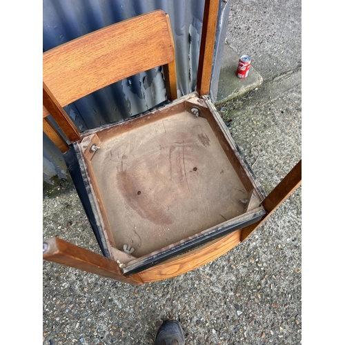 84 - Set of four Danish style dining chairs with black vinyl seats