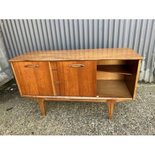 94 - Mid century teak three drawer sideboard, 128 x 44 x 73cms