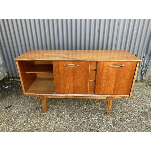 94 - Mid century teak three drawer sideboard, 128 x 44 x 73cms