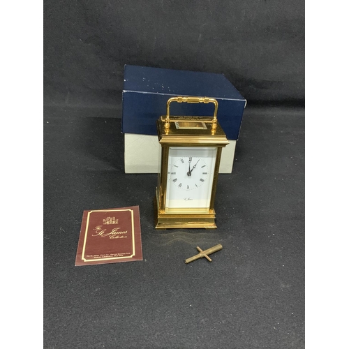 512 - 8 day carriage clock and key by St James Clock Company, height 13cms, Boxed, running