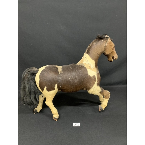 533 - Pony skin covered wooden horse figure, height to top of head 49cms, length 49cms