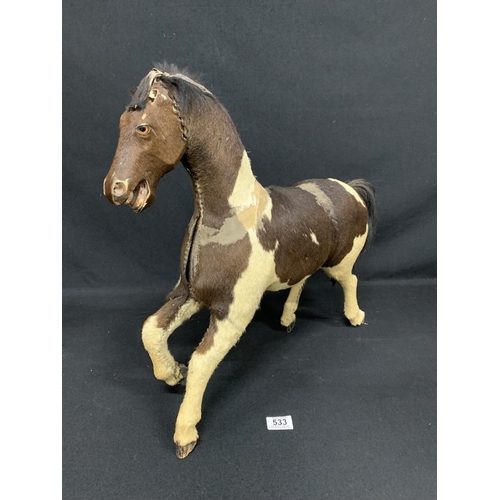 533 - Pony skin covered wooden horse figure, height to top of head 49cms, length 49cms