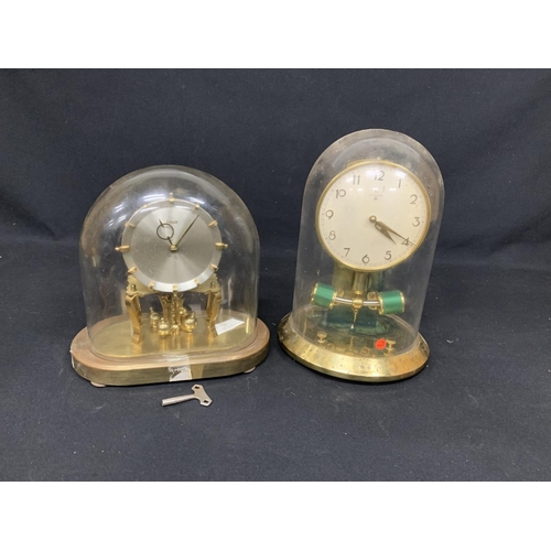 569 - Kundo Domed Clock with Key and Juhangs Domed Clock, height 33cms