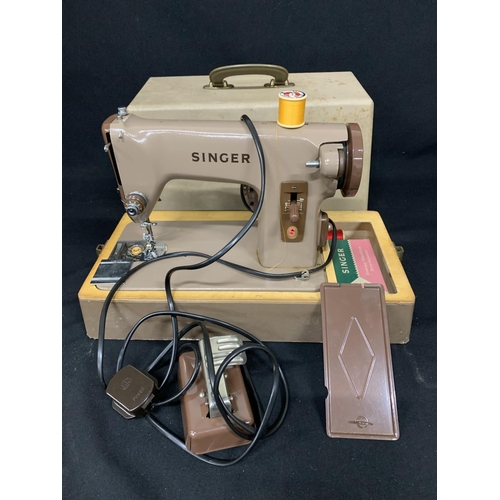 631 - Singer electric sewing machine with lead and pedal