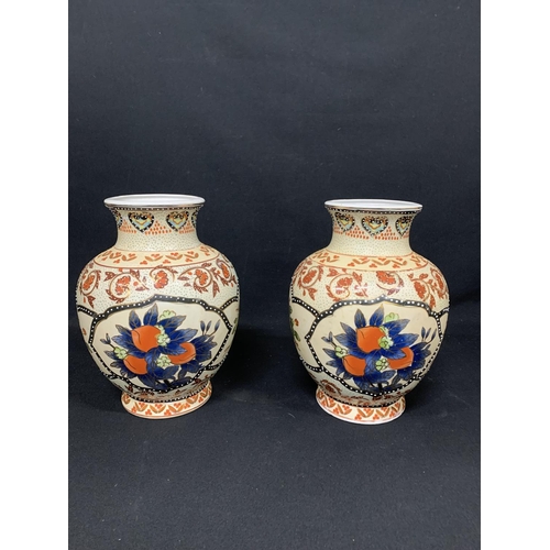 633 - Pair of oriental pattern vases height 31 c s