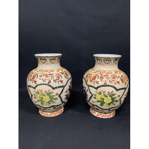 633 - Pair of oriental pattern vases height 31 c s