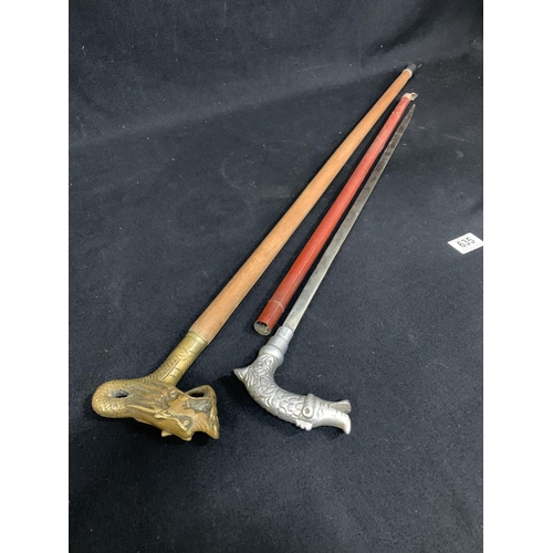 635 - A White Metal handled Sword Stick length 71 cms and Brass Dragon Head walking stick length 92 cms