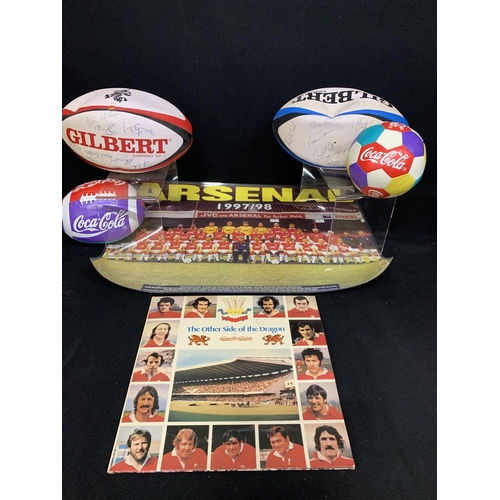 690 - Two signed Rugby balls, two Coca Cola balls, Arsenal Poster 1997/8 and The Other side of the Dragon ... 