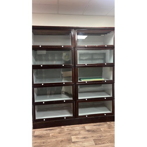 50C - A early 20th century sectional glazed shop display / bookcase unit with glass up and over doors 70 i... 