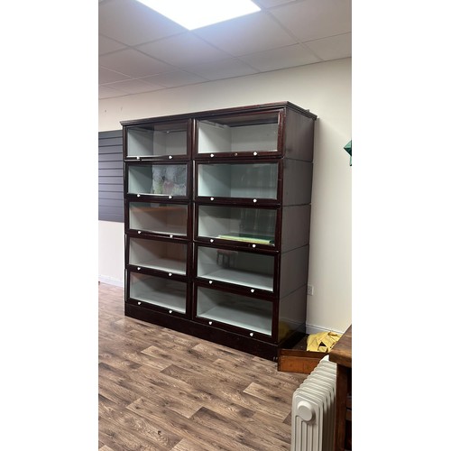 50C - A early 20th century sectional glazed shop display / bookcase unit with glass up and over doors 70 i... 