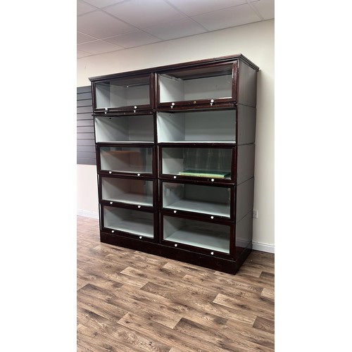 50C - A early 20th century sectional glazed shop display / bookcase unit with glass up and over doors 70 i... 