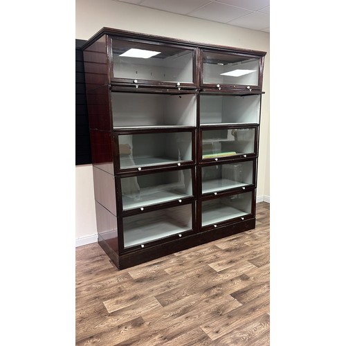 50C - A early 20th century sectional glazed shop display / bookcase unit with glass up and over doors 70 i... 