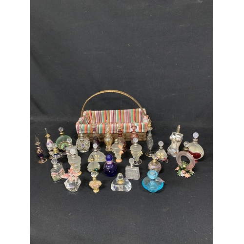 505 - Collection of 28 decorative scent bottles with basket