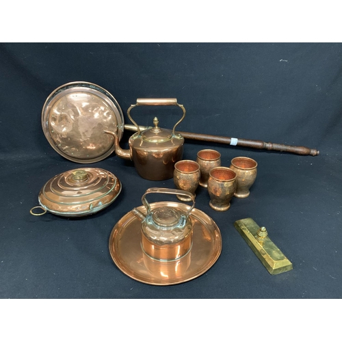 603 - Collection of copper ware, including large and small kettles and warming pans. (2)