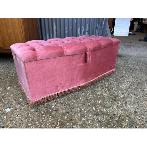 96 - A pink upholstered ottoman