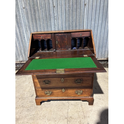 99 - A victorian mahogany bureau, fitted to the interior with writing surface and concealed drawers