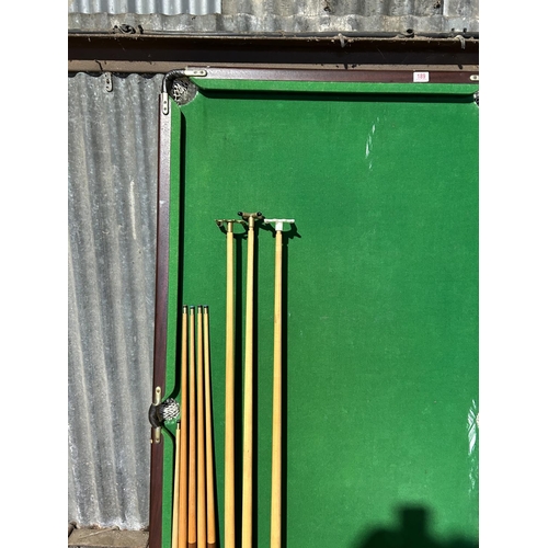 100 - A folding snooker table with cues, balls and score board