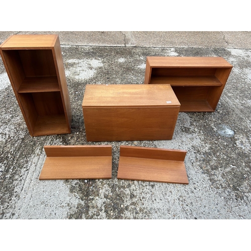 104 - A danish style teak wall mounting lounge system with bureau