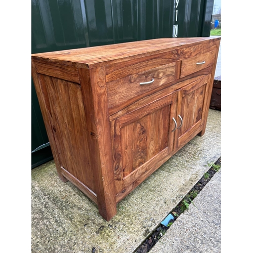 114 - A modern Indonesian hardwood sideboard