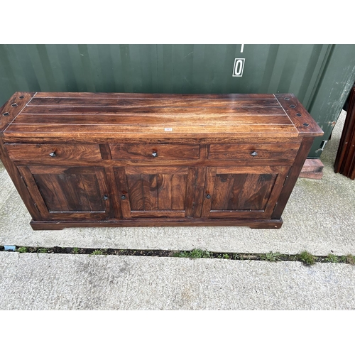 118 - An Indonesian hardwood sideboard with three drawers over three cupboards 170x44x80