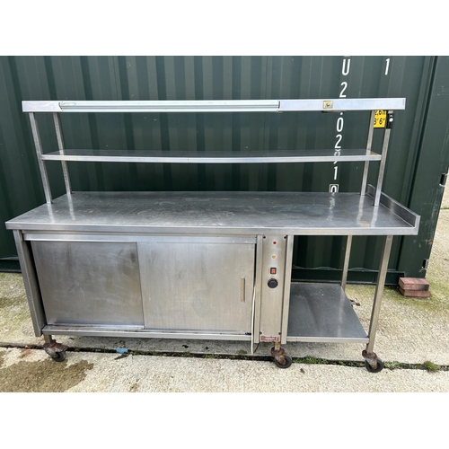 123 - A stainless steel electric heated food prep trolley counter with heated compartments 212x70x155