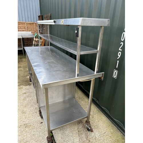 123 - A stainless steel electric heated food prep trolley counter with heated compartments 212x70x155