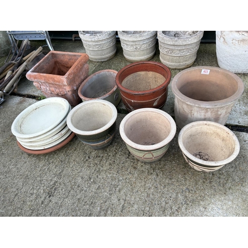 291 - Seven glazed and terracotta garden pots with four saucers