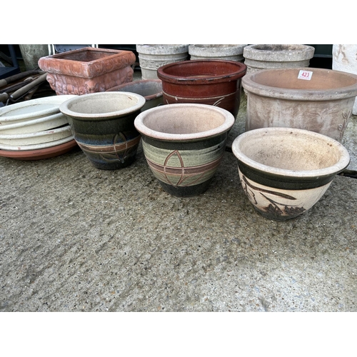 291 - Seven glazed and terracotta garden pots with four saucers