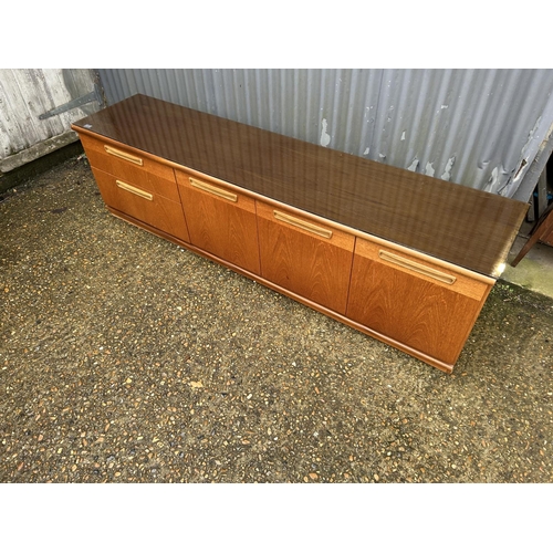 1 - A  mid century low teak sideboard by MEREDEW